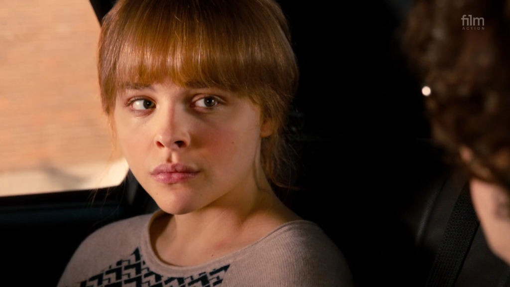 Close up in a car of Chloë Grace Moretz as Hit Girl in Kick Ass 2