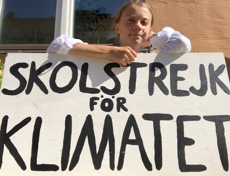 Greta with the sign reading Skolstrejk för Klimatet